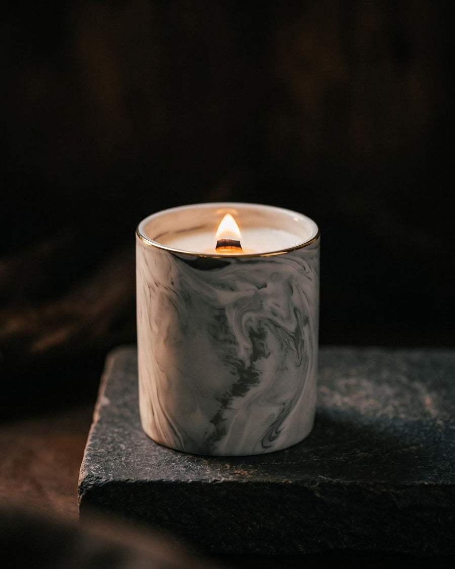 Sweet Sandalwood
candle by Lili & Koi, Cedar & Golden Amber
, lit on dark stone