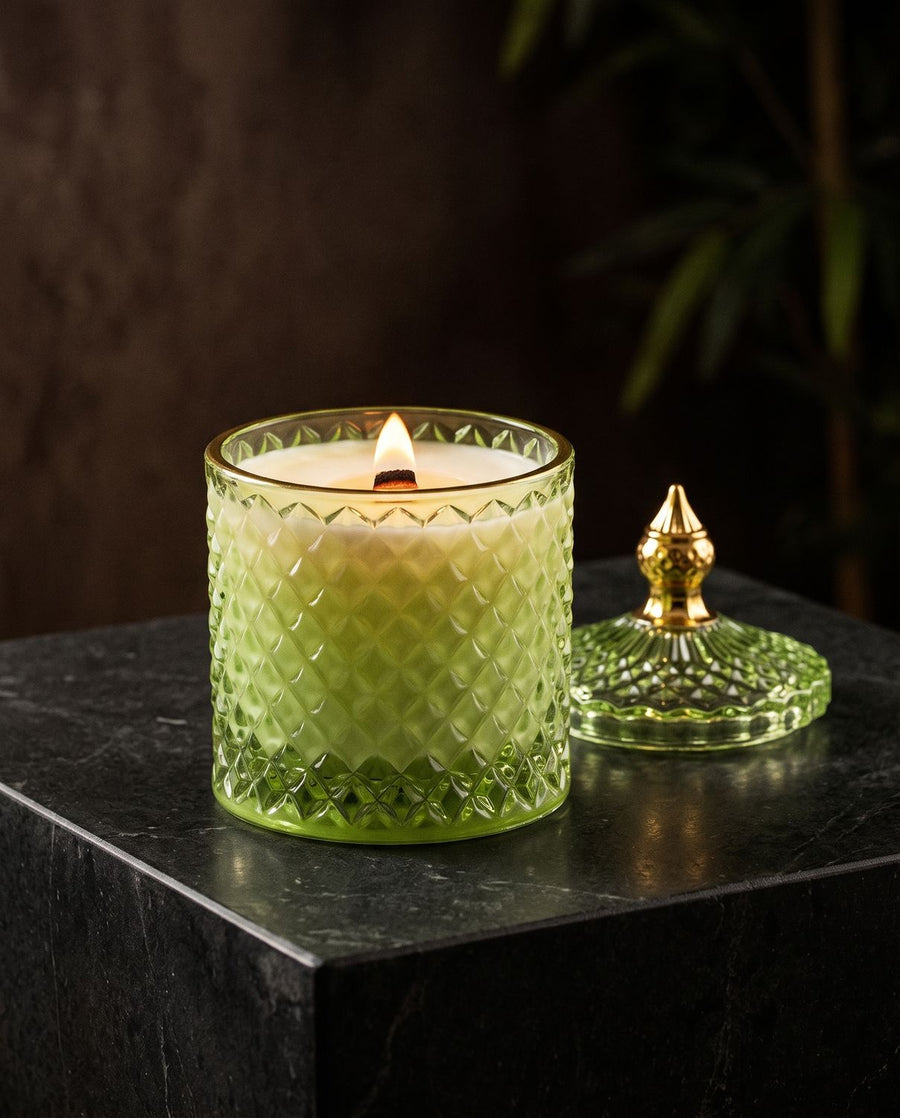 Bamboo Jungle
 candle by Lili & Koi, Bergamot & Ylang
, lit on dark stone