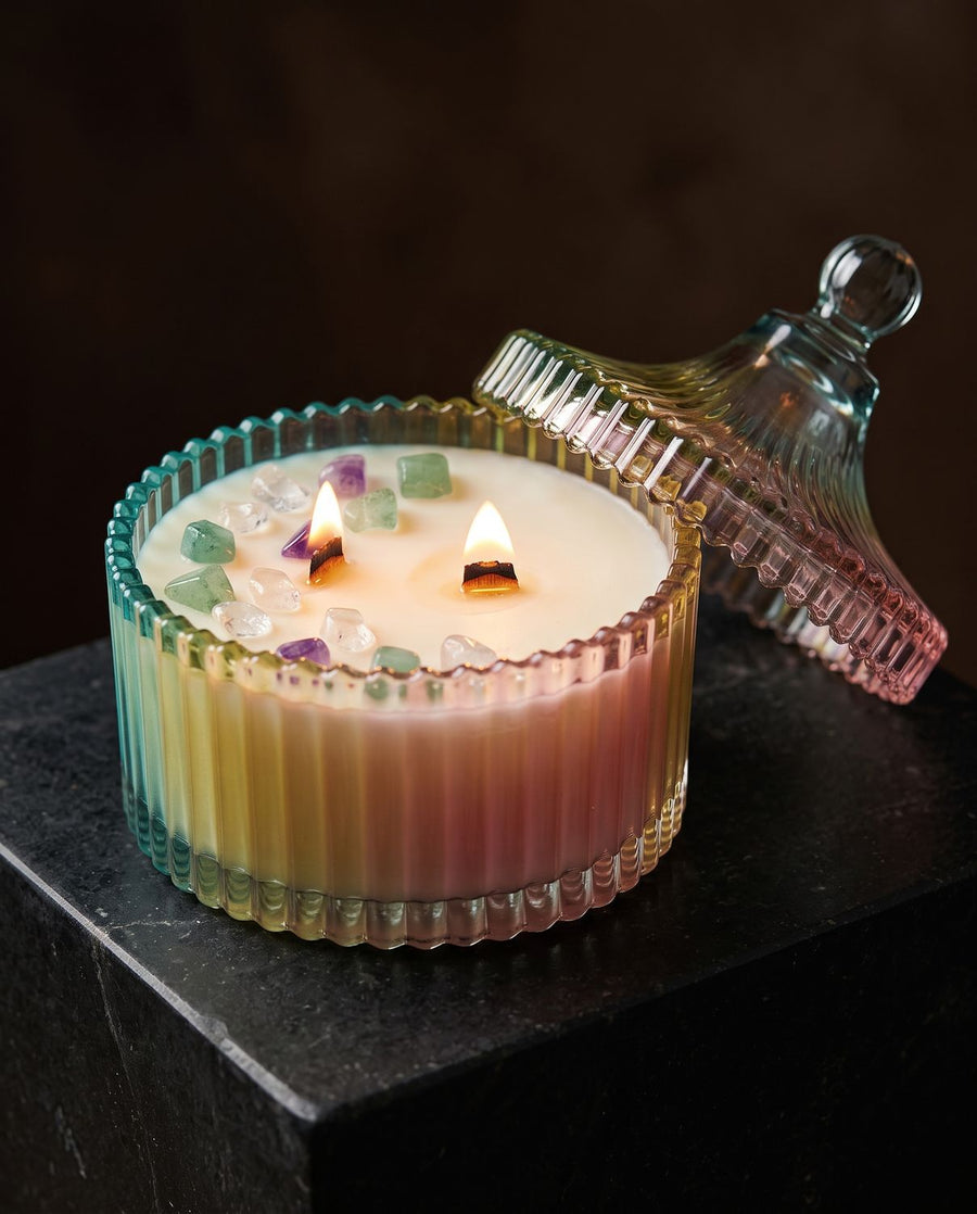 Clarity
 candle by Lili & Koi, Ylang & Peony
, lit on dark stone