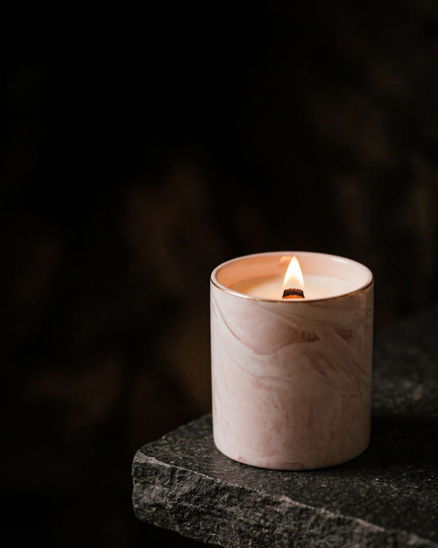 Strawberries & Cream
 candle by Lili & Koi, Strawberry & Vanilla
, lit on dark stone